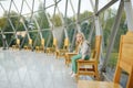 MERKINE, LITHUANIA - AUGUST 16, 2018: Little girl inside Merkine Pyramid, protected by a glass dome, famous for healing and