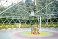 MERKINE, LITHUANIA - AUGUST 16, 2018: Little girls inside Merkine Pyramid, protected by a glass dome, famous for healing and