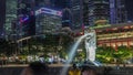 The Merlion fountain and Singapore skyline night timelapse hyperlapse. Royalty Free Stock Photo