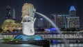 The Merlion fountain and Singapore skyline night timelapse hyperlapse. Royalty Free Stock Photo