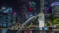 The Merlion fountain and Singapore skyline night timelapse hyperlapse. Royalty Free Stock Photo