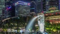 The Merlion fountain and Singapore skyline night timelapse hyperlapse. Royalty Free Stock Photo