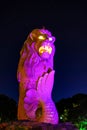 Merlion, lit up, mascot of Singapore, a mythical creature with a lion`s head and fish body, Sentosa, Singapore Royalty Free Stock Photo