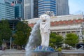 Merlion with skyscraper buildings in Singapore City at noon. Financial district in downtown with business centers in technology