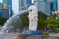 Merlion with skyscraper buildings in Singapore City at noon. Financial district in downtown with business centers in technology