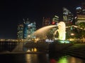 Merlion statue fountain and city skyline at night in singapore Royalty Free Stock Photo