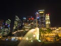 Merlion statue fountain and city skyline at night in singapore Royalty Free Stock Photo