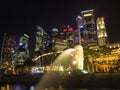 Merlion statue fountain and city skyline at night in singapore Royalty Free Stock Photo