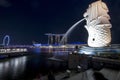 Merlion statue fountain in Merlion Park and Singapore city skyline at night Royalty Free Stock Photo