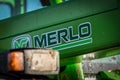 Merlo farming equipment, tractor lifting straw bale