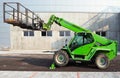 Merlo telescopic handler mounted with a large work aerial platform.
