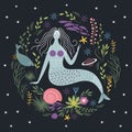 Mermaid among algae and fishes