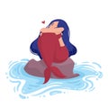 Mermaid with blue hair and red tail sits on a stone in the water and hugging knees