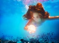 Mermaid girl underwater hold magic ball sphere