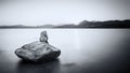 Mermaid sculpture on rock in Ile Rousse Corsica at sunrise Royalty Free Stock Photo