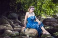 Mermaid of Sea in Artistic Caucasian Blond Woman With Strasses on Face Sitting in Blue Wet Dress on Rocky Shore Outdoor Royalty Free Stock Photo