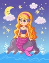 The mermaid sits on a stone above the sea and looks at the moon at night