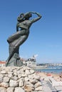 Mermaid statue looking at the sea in Portugal