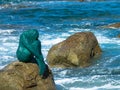 Mermaid statue on rock at L`ile Rousse harbor in the Balagne region of Corsica Royalty Free Stock Photo