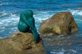 Mermaid statue on rock at L`ile Rousse harbor in the Balagne region of Corsica Royalty Free Stock Photo