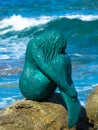 Mermaid statue on rock at L`ile Rousse harbor in the Balagne region of Corsica Royalty Free Stock Photo