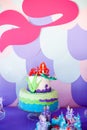 Mermaid theme cake with colorful glitter tails, shells and sea creatures toppers for children`s, teen`s, novelty birthday and Royalty Free Stock Photo