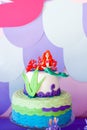 Mermaid theme cake with colorful glitter tails, shells and sea creatures toppers for children`s, teen`s, novelty birthday and Royalty Free Stock Photo