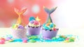 Mermaid theme cupcakes with colorful glitter tails, shells and sea creatures. Royalty Free Stock Photo