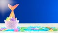 Mermaid theme cupcakes with colorful glitter tails, shells and sea creatures. Royalty Free Stock Photo