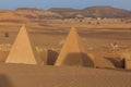 MEROE, SUDAN - MARCH 4, 2019: Local riding a camel near the pyramids of Meroe, Sud