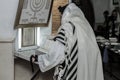 MERON, ISRAEL - December 29, 2015: Orthodox Jews pary in the tomb of Rabbi Shimon Bar Yochai, in Meron, Israel. Jewish Man wrapped Royalty Free Stock Photo