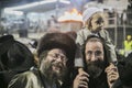 MERON,ISRAEL- MAY 26, 2016: An unidentified adorable Hasidic boy rejoices on his fathers' shoulders while wearing his fathers