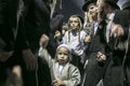 MERON,ISRAEL- MAY 26, 2016: An unidentified adorable Hasidic boy rejoices on his fathers' shoulders while wearing his fathers