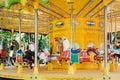 Merry carousel in the city park in the early morning. There is no one here. Carousels with horses are waiting for children. Royalty Free Stock Photo