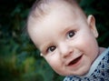 Merry child on background of the nature