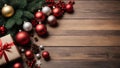 Merry Christmas background. New Year\'s decorations on wooden table - colorful balls and gifts. Top view with copy space