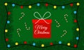 Merry Christmas background with red present, spruce branches, garland, candy canes and lettering on green backdrop. Xmas cartoon