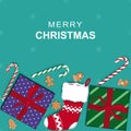 Merry Christmas background with Christmas stocking, gifts, candy canes and gingerbread cookies