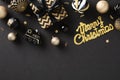Merry Christmas black background with luxury Xmas balls, art deco style gift box, confetti. Christmas modern background, greeting