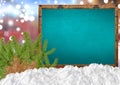 Merry Christmas on blank blue blackboard with blurr city pine Royalty Free Stock Photo