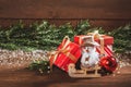 Merry Christmas. Boxes with gifts, wooden Christmas decorations and fir branches Royalty Free Stock Photo