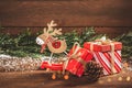 Merry Christmas. Boxes with gifts, wooden Christmas decorations and fir branches Royalty Free Stock Photo