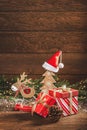 Merry Christmas. Boxes with gifts, wooden Christmas decorations and fir branches Royalty Free Stock Photo