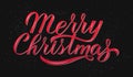 Merry Christmas calligraphy lettering on black background. Celebration quote hand painted with brush. Holidays typography poster. Royalty Free Stock Photo