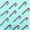 Merry Christmas candy can in row on blue background. Flat lay. Square image. Royalty Free Stock Photo