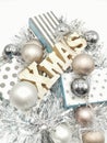 Merry Christmas card with gift boxes, silvered ribbons and balls isolated in white background Royalty Free Stock Photo