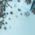Merry Christmas card made of gift boxes, blue, white, silver decorations, bows, fir branches, sparkles and confetti on blue Royalty Free Stock Photo