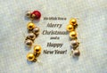 Merry Christmas Card with Metallic Background, Gold Balls and Text for Seasons Greetings Royalty Free Stock Photo