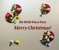 Merry Christmas Card with Metallic Background and Red Gold Balls for Seasons Greetings Royalty Free Stock Photo