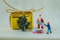 Merry Christmas celebration story with miniature figure Santa cl